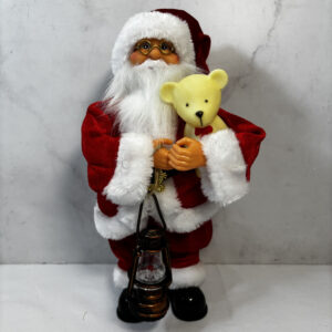 Papá Noel con osito en sus manos. Adorno de navidad.