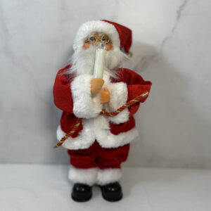 Papá Noel, sosteniendo una vela. Adorno de navidad